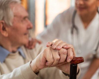 casual-senior-man-home-with-doctor-1-1