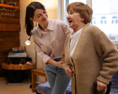 female-caretaker-her-client-s-house-taking-care-elderly-person-1