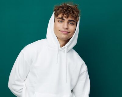 portrait-young-woman-standing-against-blue-background_1048944-18432523