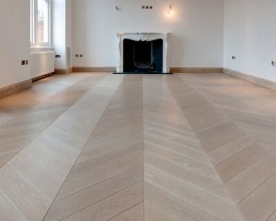 Light-chevron-wooden-flooring-in-a-modern-empty-living-room