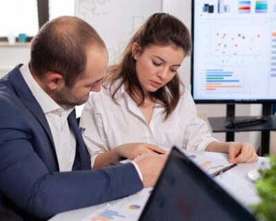 colleagues-startup-business-discussing-looking-documents-company-board-brainstorming-conference-room-checking-graphs-charts_482257-5028