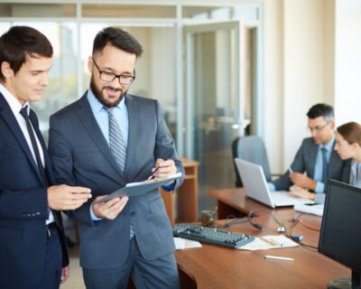 successful-businessmen-talking-each-other-scaled-e1754944158170-1024×683-1