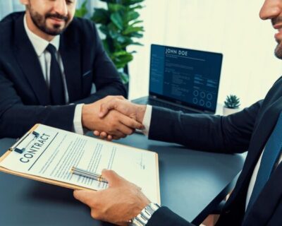 two-men-shaking-hands-with-contract-that-says-join-job-it_31965-138576