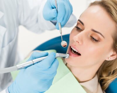 doctor-using-dental-drill-during-procedure-in-modern-dental-clinic