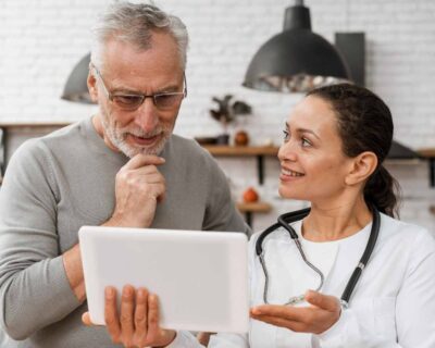 doctor-posing-with-her-patient-90kb