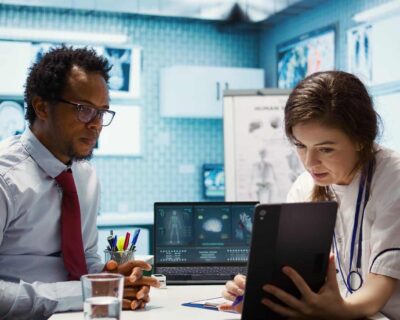 general-practitioner-presenting-test-findings-via-scan-interpretation-tablet-90kb